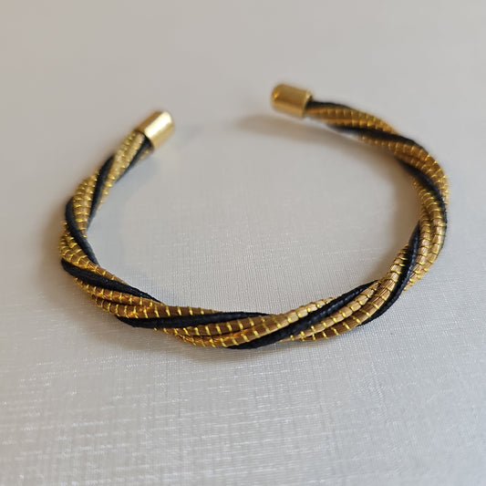 Golden Grass Open Bangle Bracelet with a black finish.