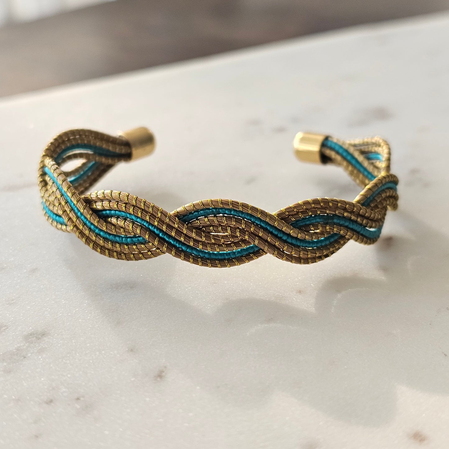 Thick Golden Grass Bracelet with blue accents and natural details.