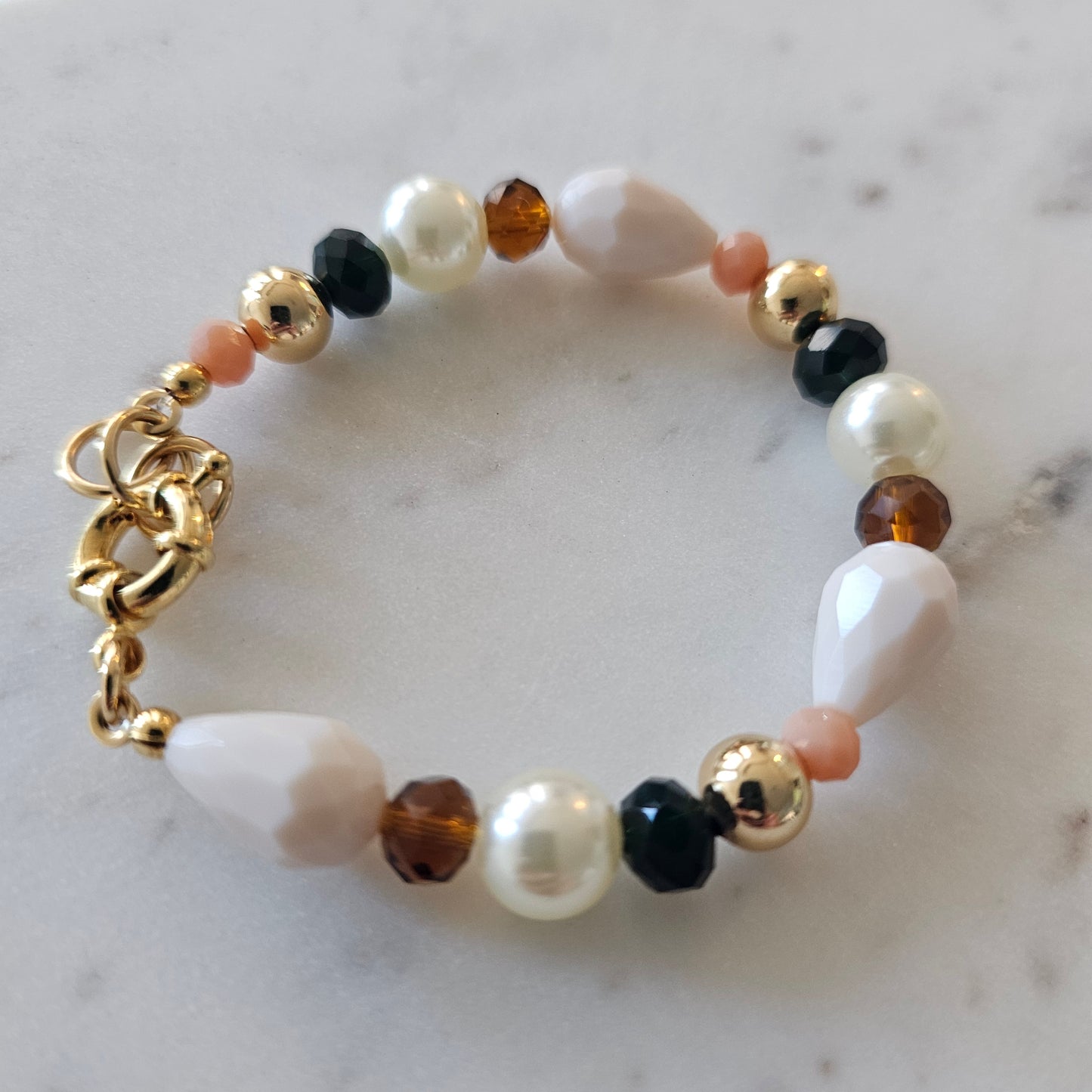 18K Gold Plated Bracelet with brown crystals, pearls, and white stones.