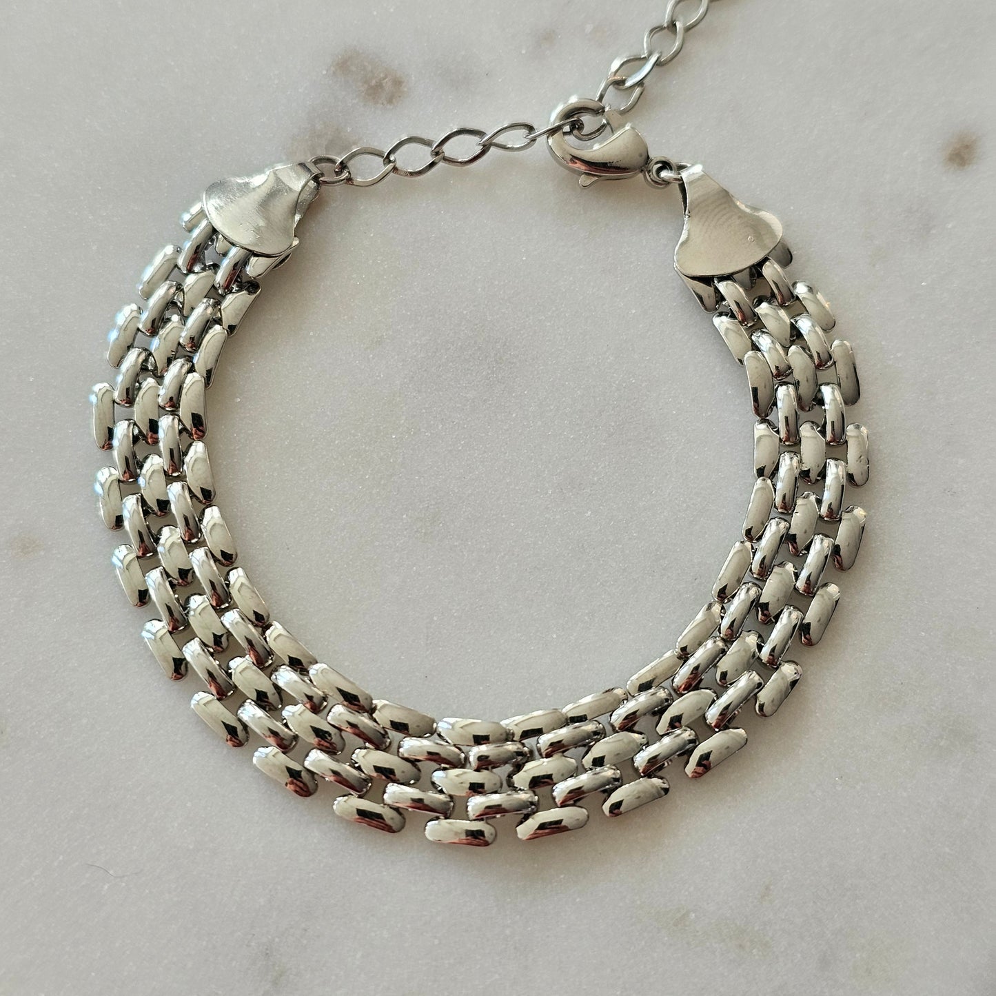 White Rhodium Plated Bracelet inspired by watch-like elegance.