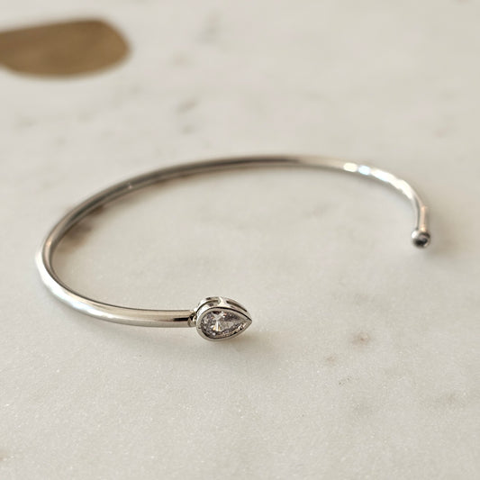 White Rhodium Plated Bracelet with teardrop zirconia accents.