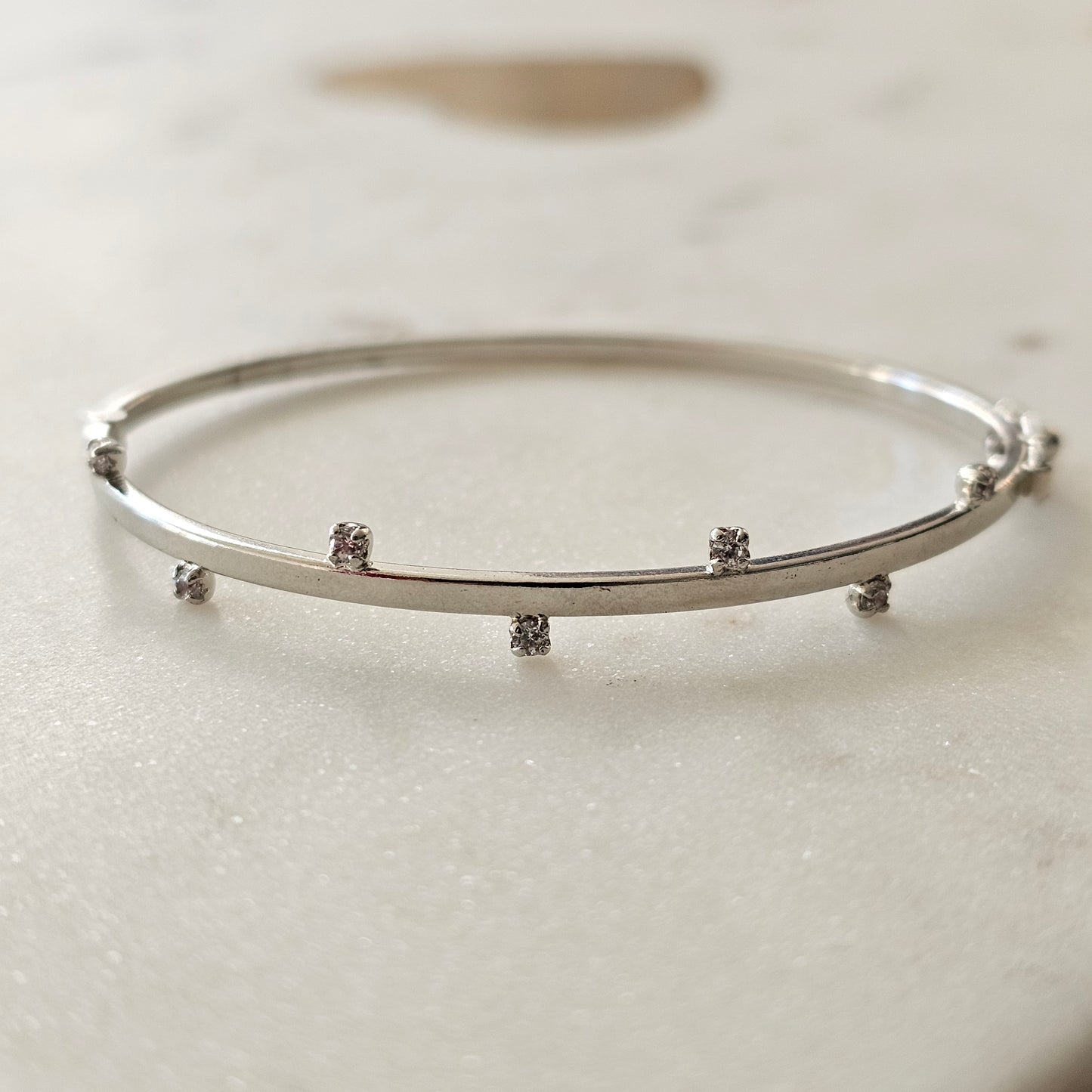 White Rhodium Plated Cuff Bracelet with sparkling zirconia details.