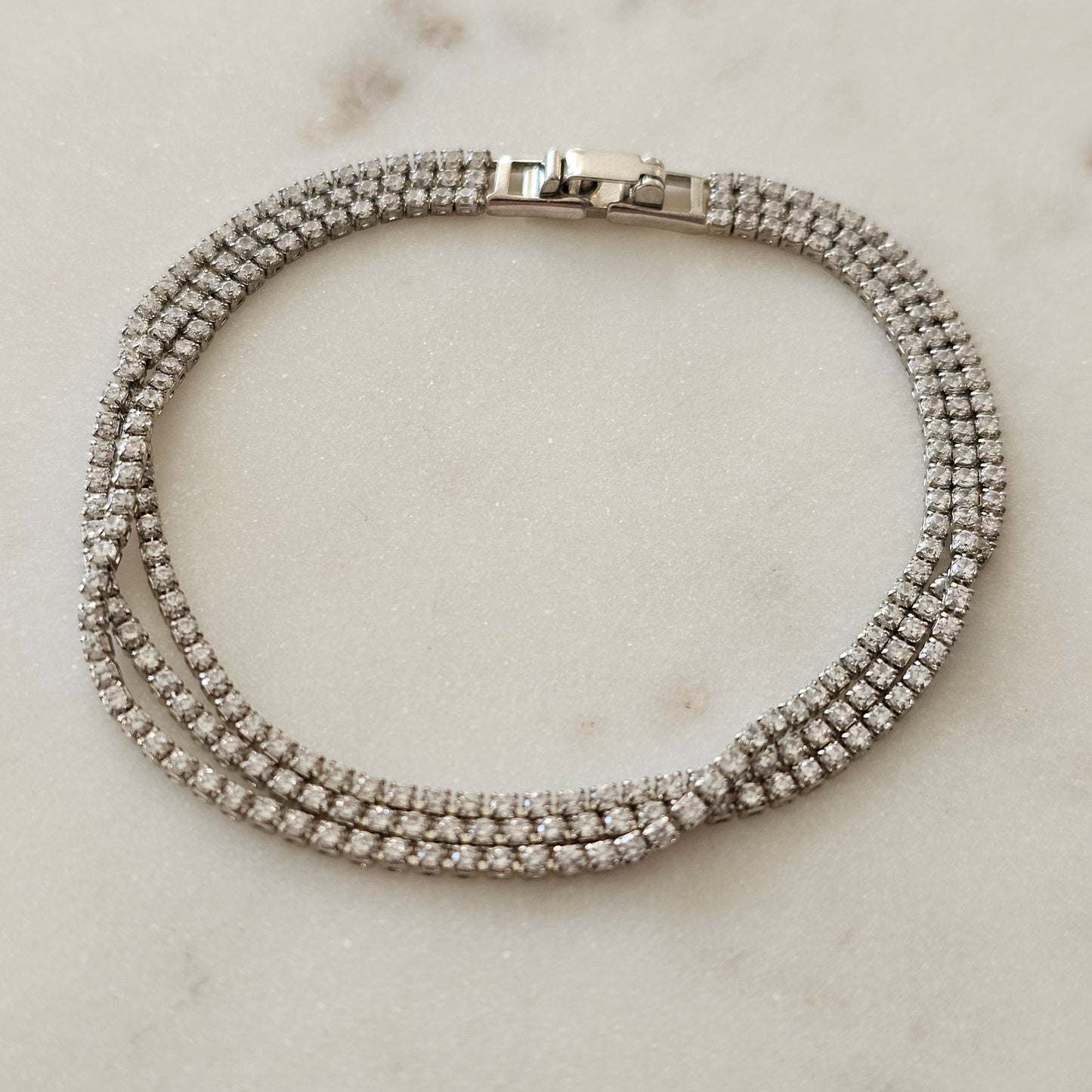 White Rhodium Plated Bracelet with three thin tennis-style rows.