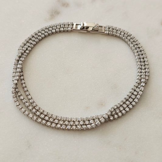 White Rhodium Plated Bracelet with three thin tennis-style rows.