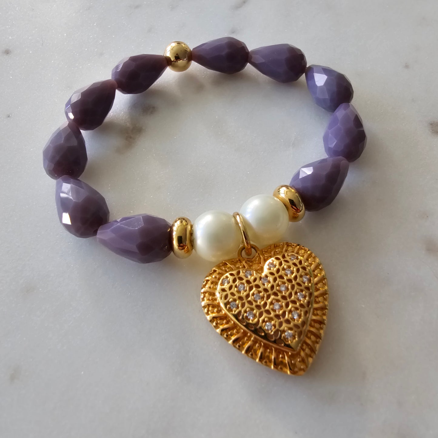 18K Gold Plated Bracelet with lavender pear stones and studded hearts.