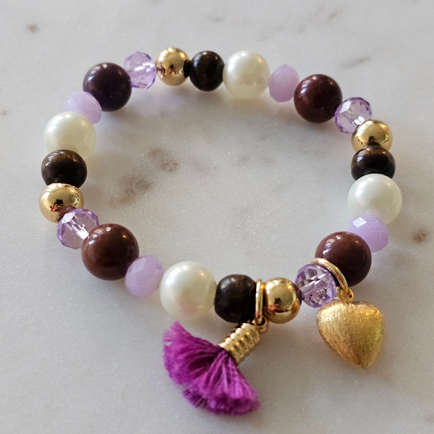 18K Gold Plated Bracelet with purple crystals, pearls, and wood balls.