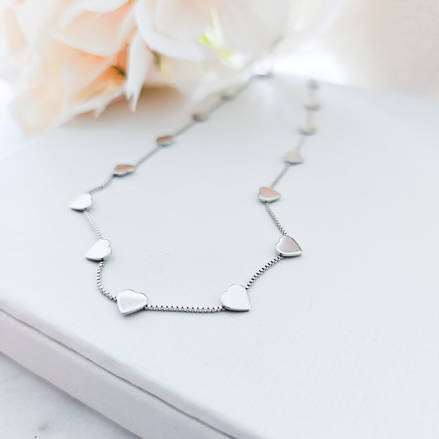 White Rhodium Plated Delicate Mini Hearts Necklace