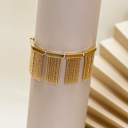 18K Gold Plated Adjustable Bracelet with fringe ball and tube accents.