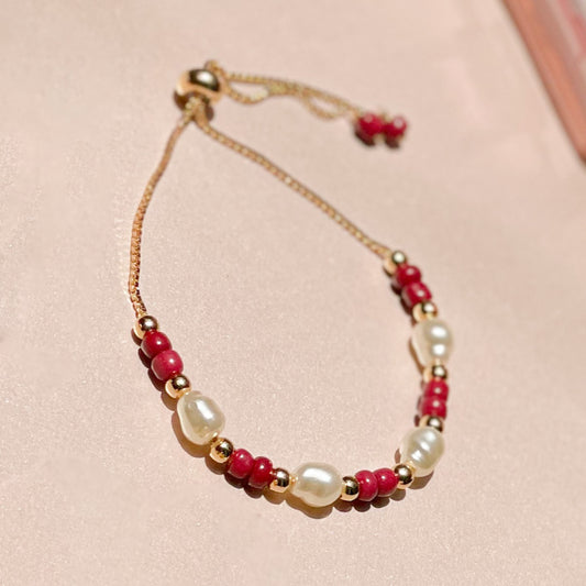 18K Gold Plated Bracelet with adjustable pink balls and pearls.