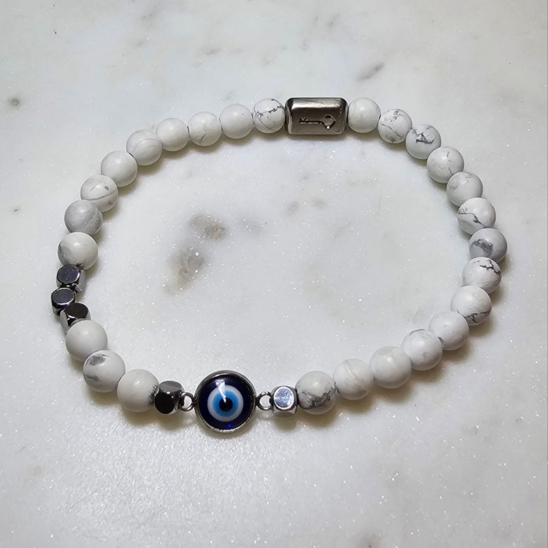 Men's Bracelet with white howlite balls and an evil eye charm.