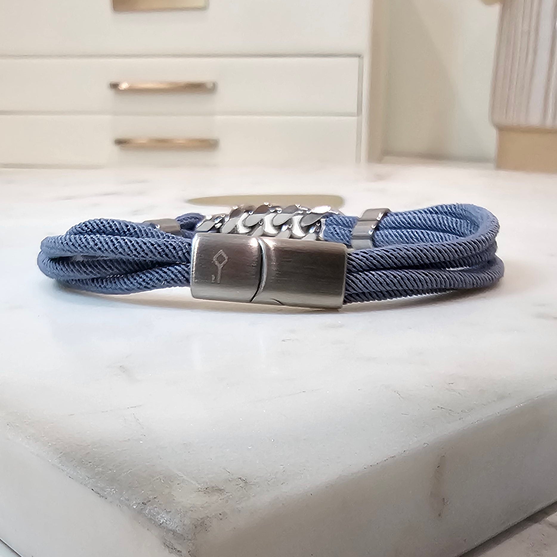 Men's Bracelet with blue cord and stainless steel accents.