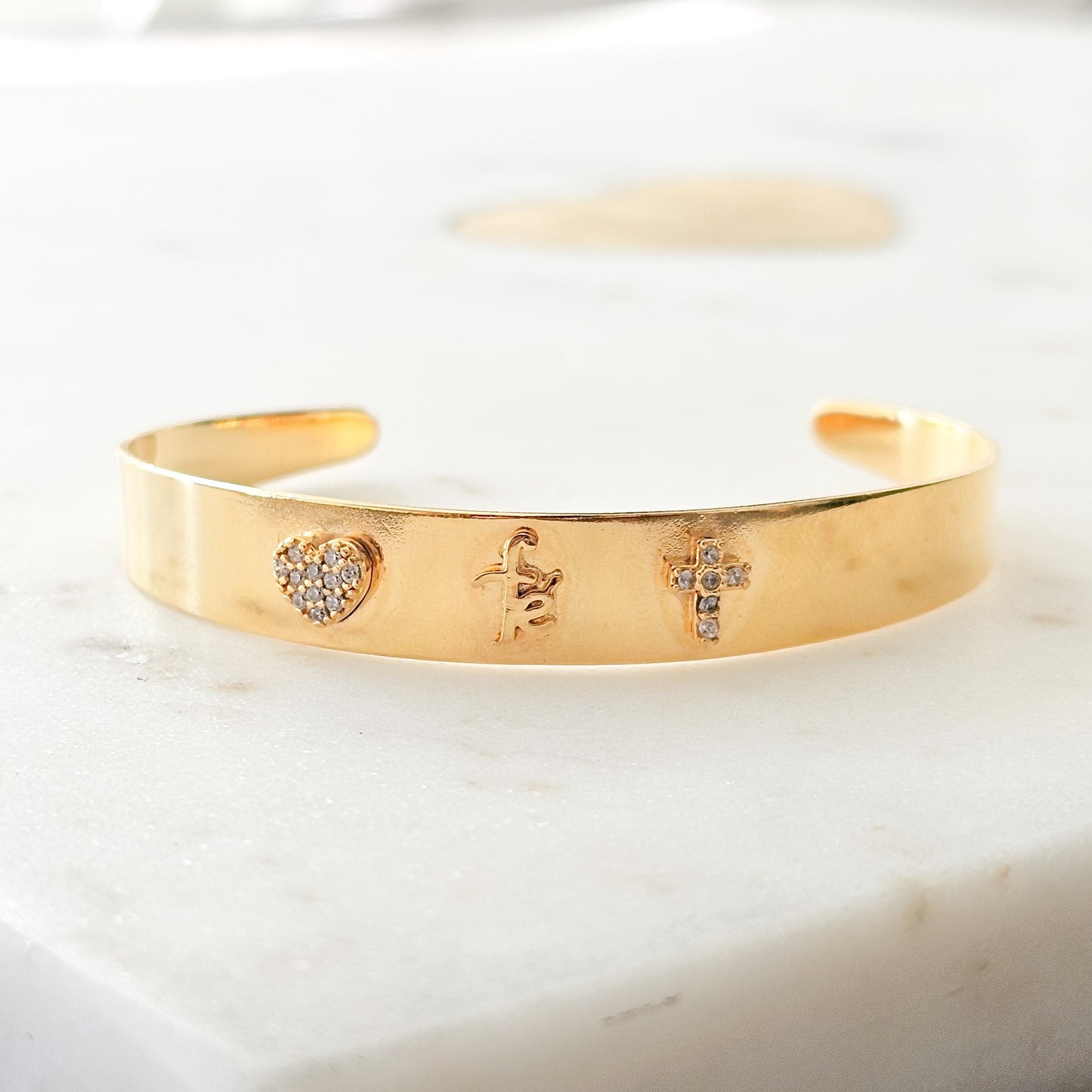 18K Gold Plated Bracelet with zirconia and heart cross details.