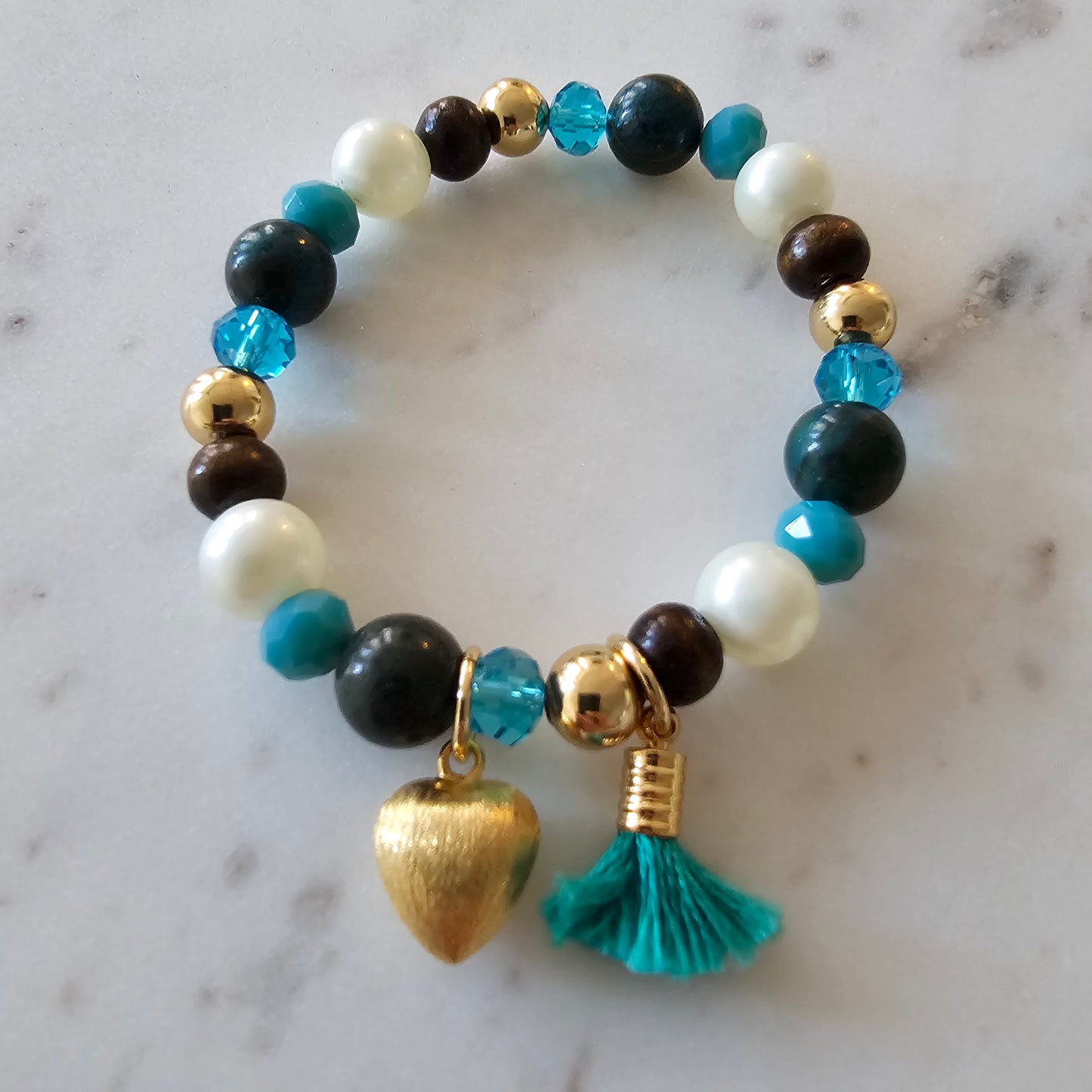 18K Gold Plated Bracelet with blue crystals, wood, and pearls.