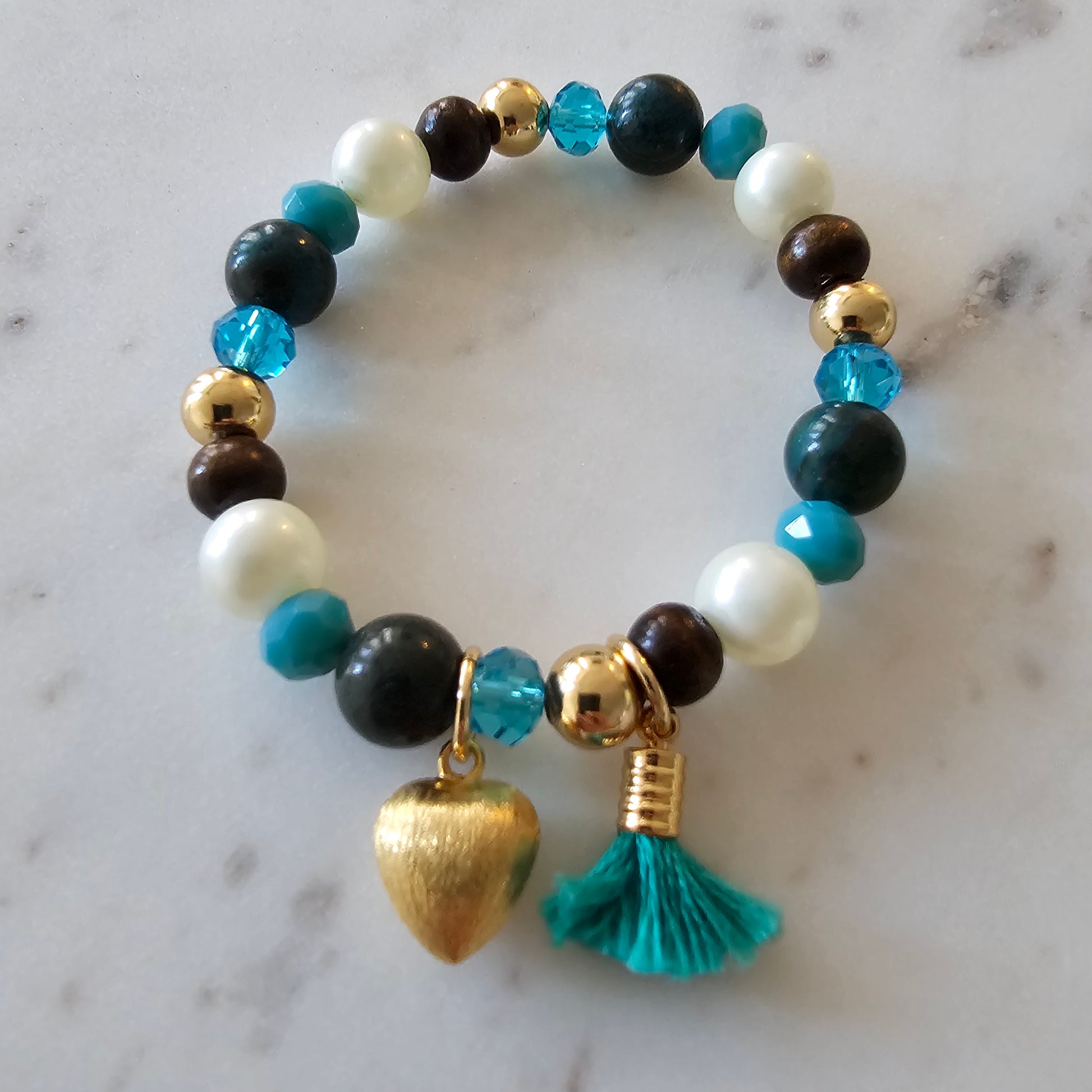 18K Gold Plated Bracelet with blue crystals, wood, and pearls.