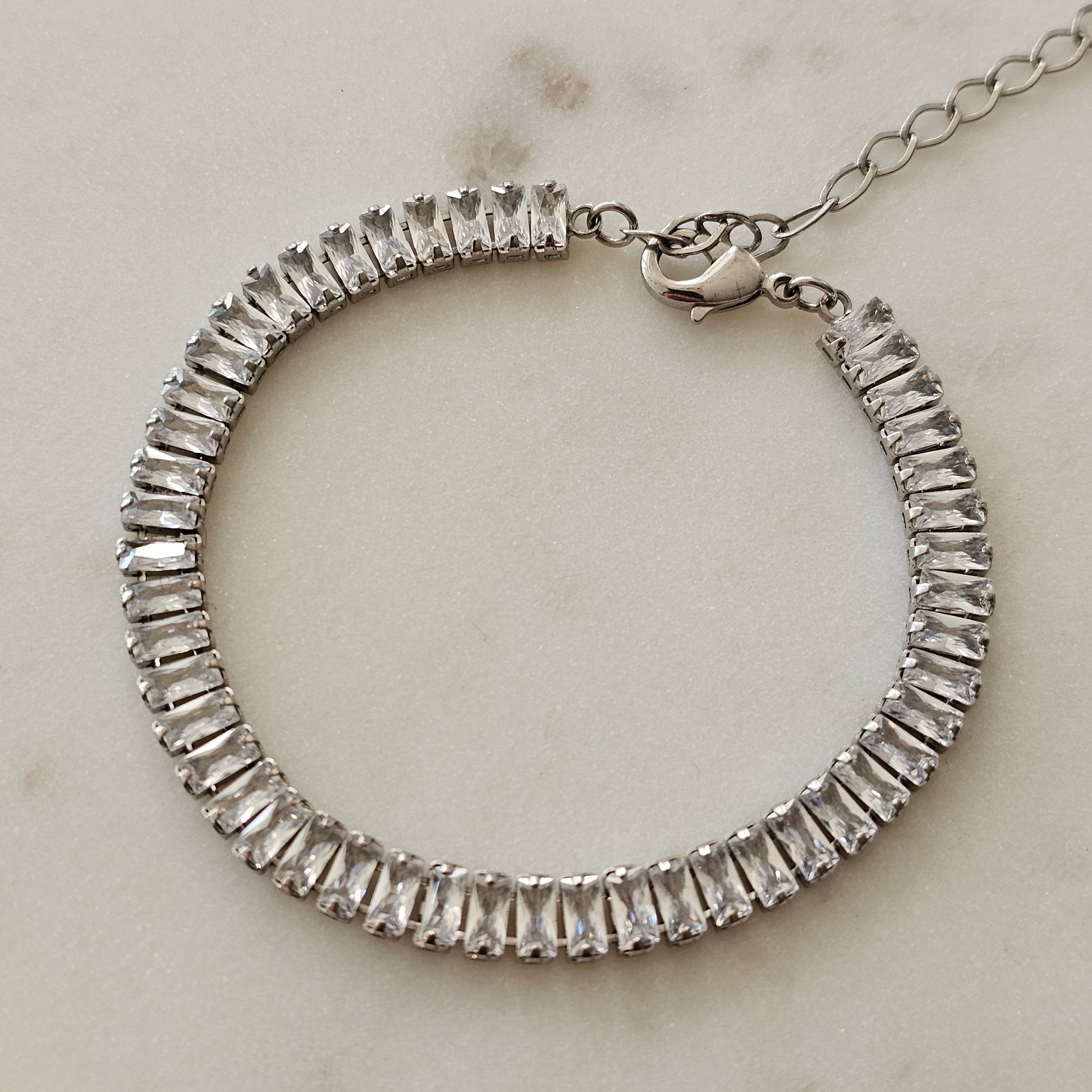 White Rhodium Plated Bracelet with baguette zirconia stones.