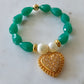 18K Gold Plated Bracelet with green pear stones and studded hearts.