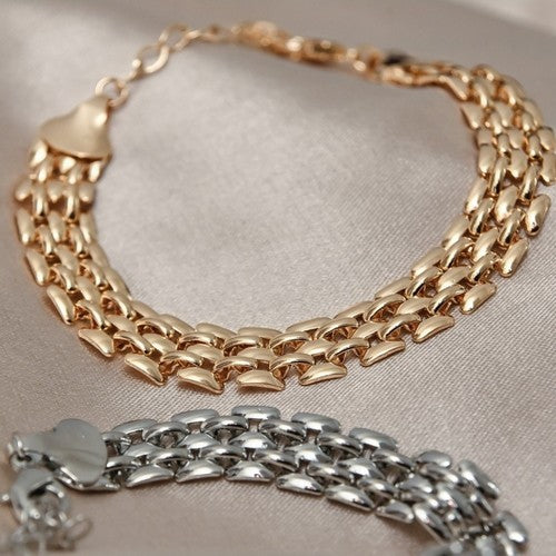 18K Gold Plated Bracelet designed with a bold watch-inspired style.