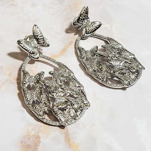 White Rhodium Plated Dangling Oval Butterfly Earrings