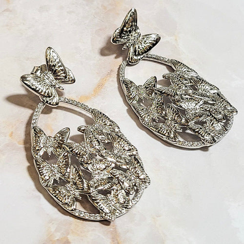 White Rhodium Plated Dangling Oval Butterfly Earrings