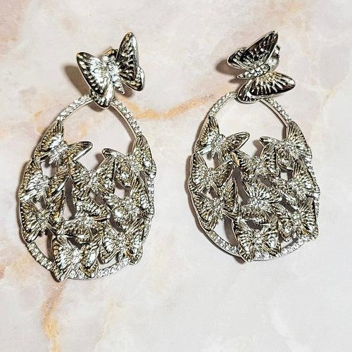 White Rhodium Plated Dangling Oval Butterfly Earrings