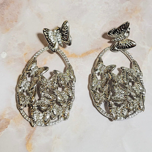 White Rhodium Plated Dangling Oval Butterfly Earrings