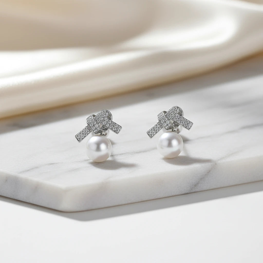 Studded Zirconia Bow and Pearl Earrings - White Rhodium Plated