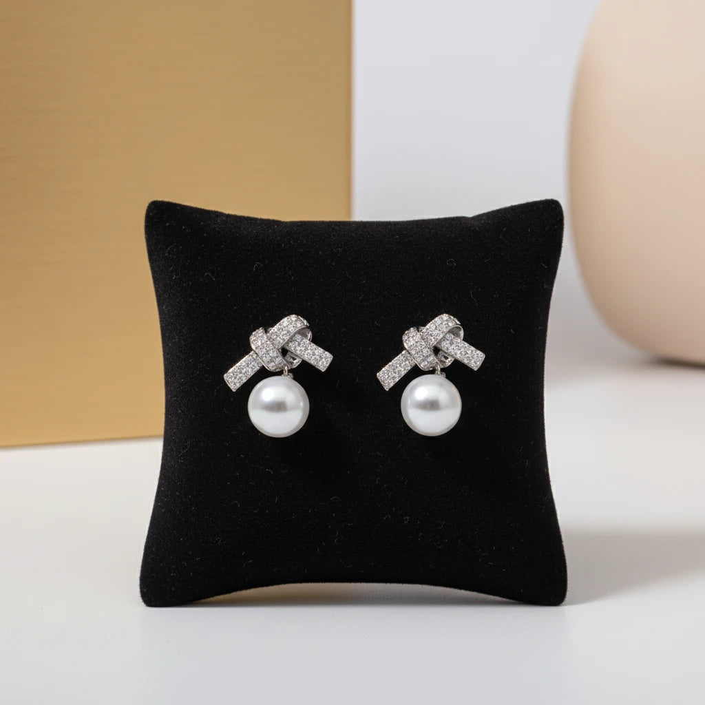 Studded Zirconia Bow and Pearl Earrings - White Rhodium Plated