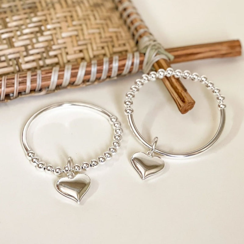 White Rhodium Plated Bracelet with a delicate heart pendant.