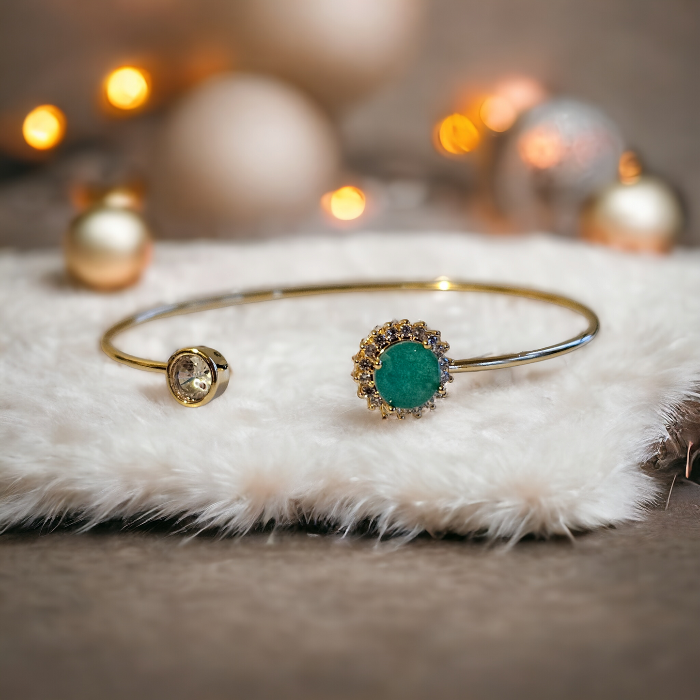 18K Gold Plated Open Bangle with emerald zirconia details.