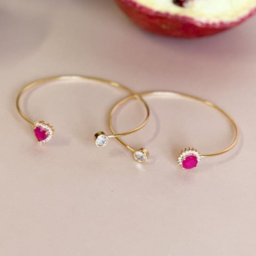 18K Gold Plated Open Bangle with pink sapphire zirconia stones.